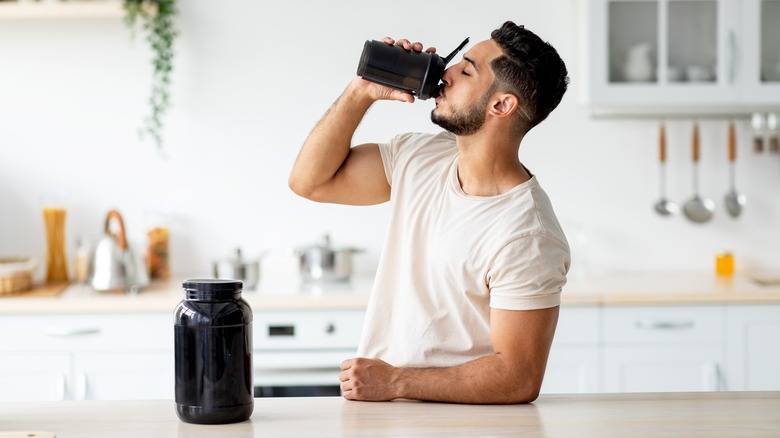 A health conscious man drinking protein shake