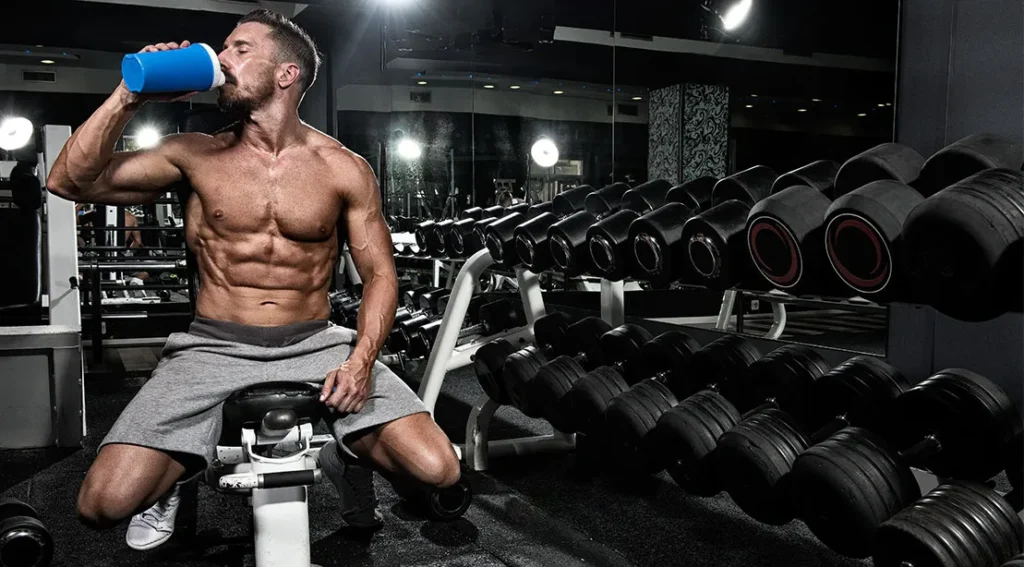 An athlete drinking between sets.