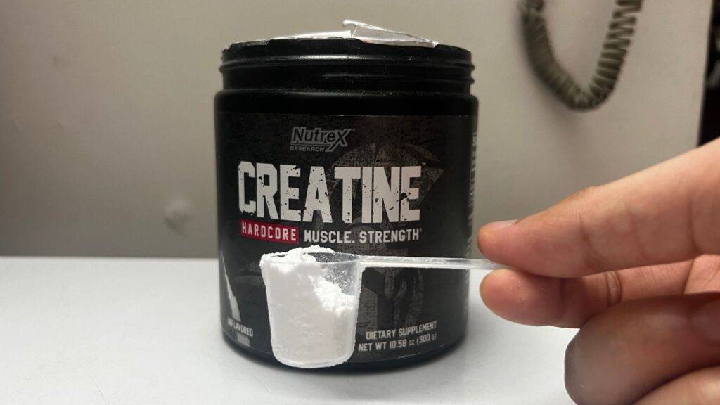 Measuring Creatine Powder with Scoop.