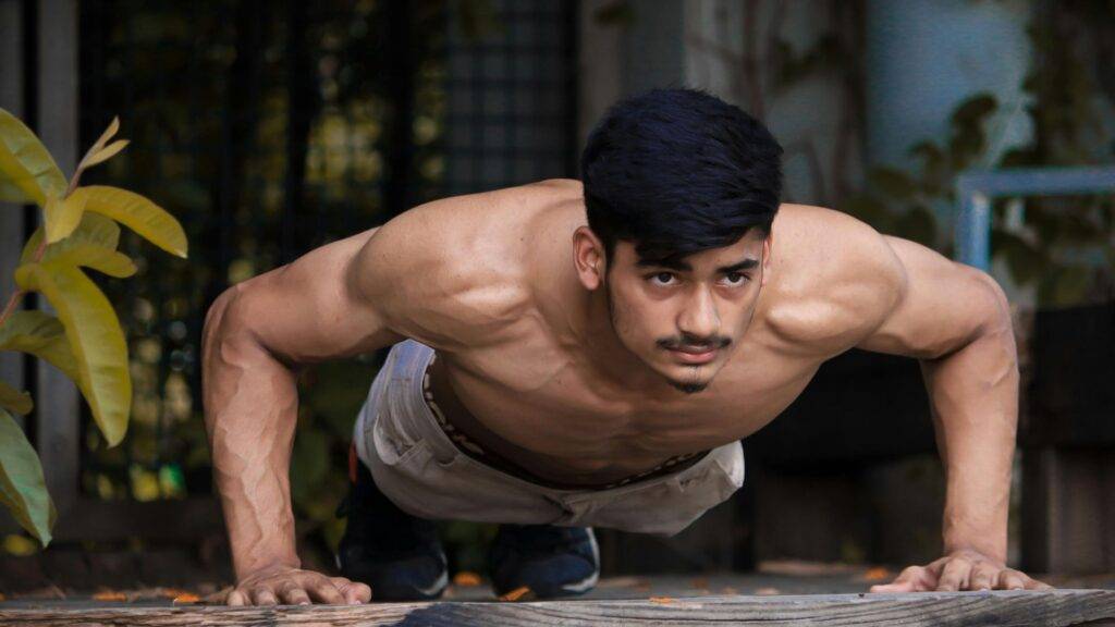 A man doing push ups.