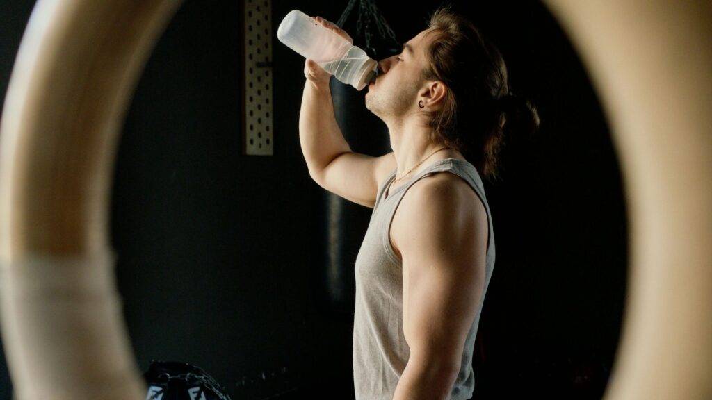 Man Drinking from Bottle