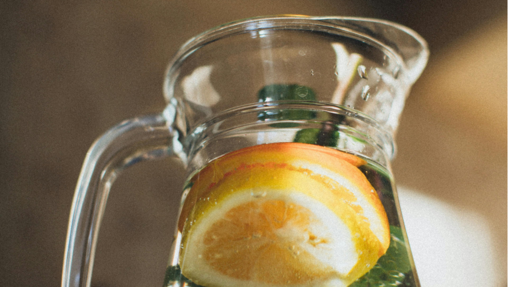 Water With Sliced Lemon in Pitcher.